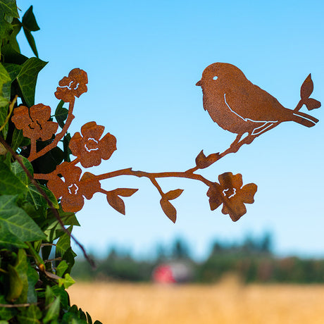  Rustic home and garden decor rusty bird on dogwood branch on ivy covered tree with barn and farm in the background